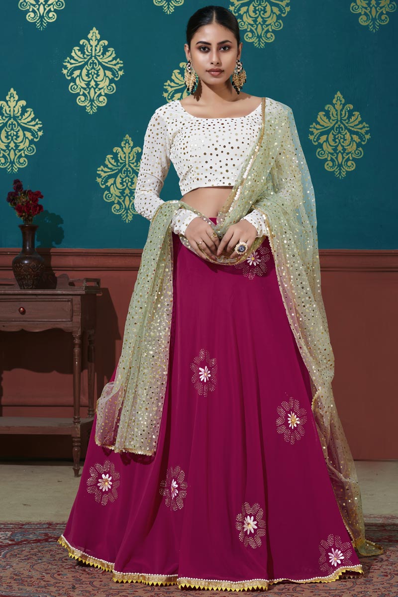 Sangeet Wear Elegant Georgette Fabric Foil Printed Lehenga In Rani Color