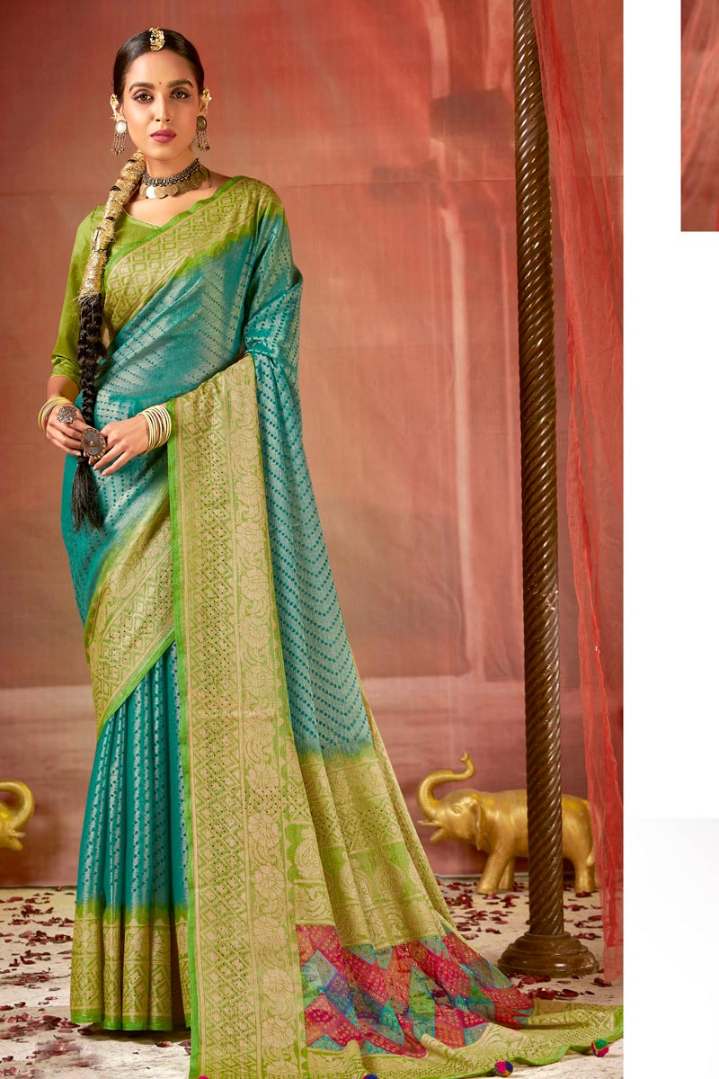 Daily Wear Majestic Brasso Fabric Teal Color Saree With Foil Printed Work