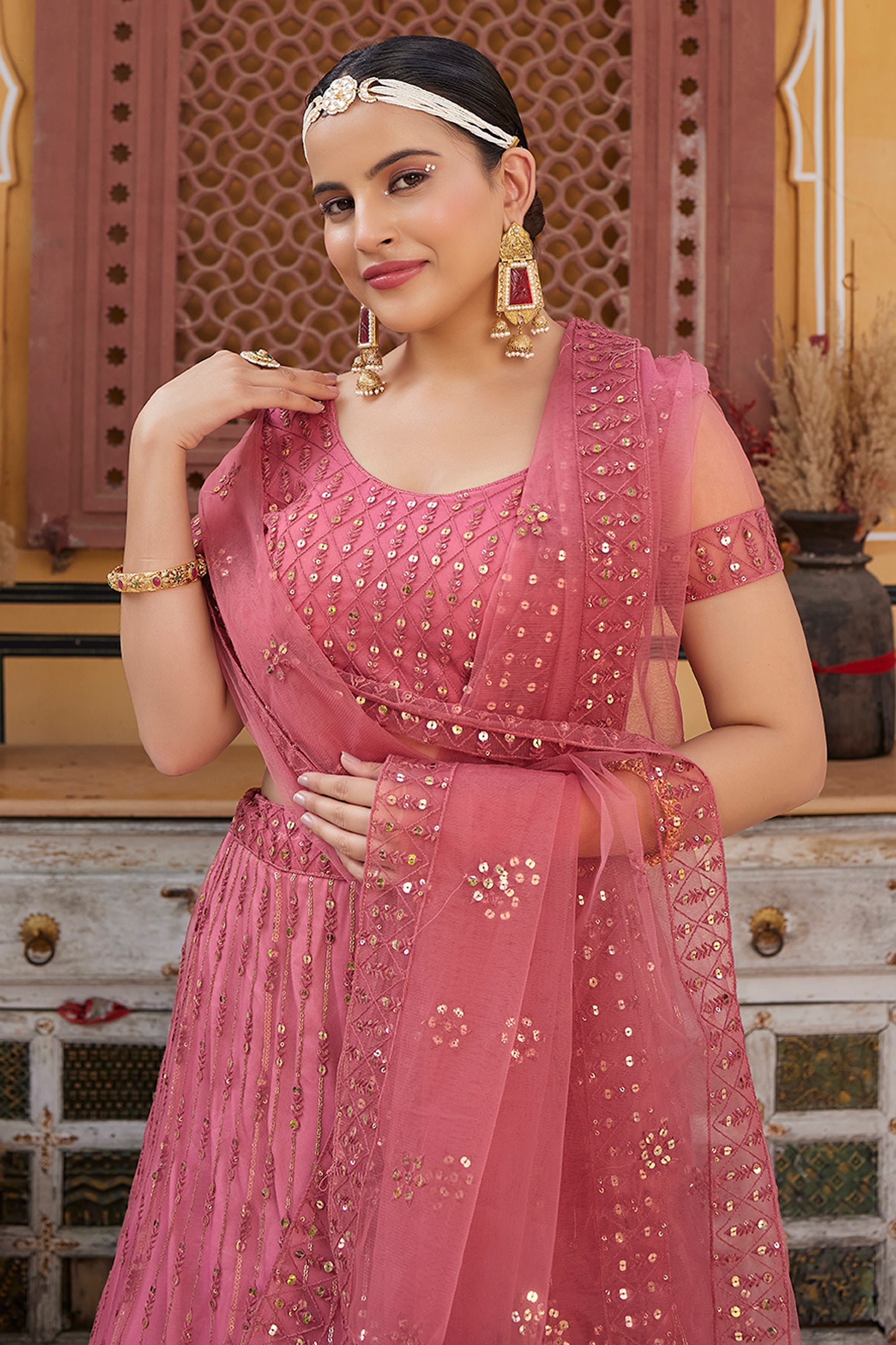 Phenomenal Sequins Work Pink Color Net Fabric Lehenga