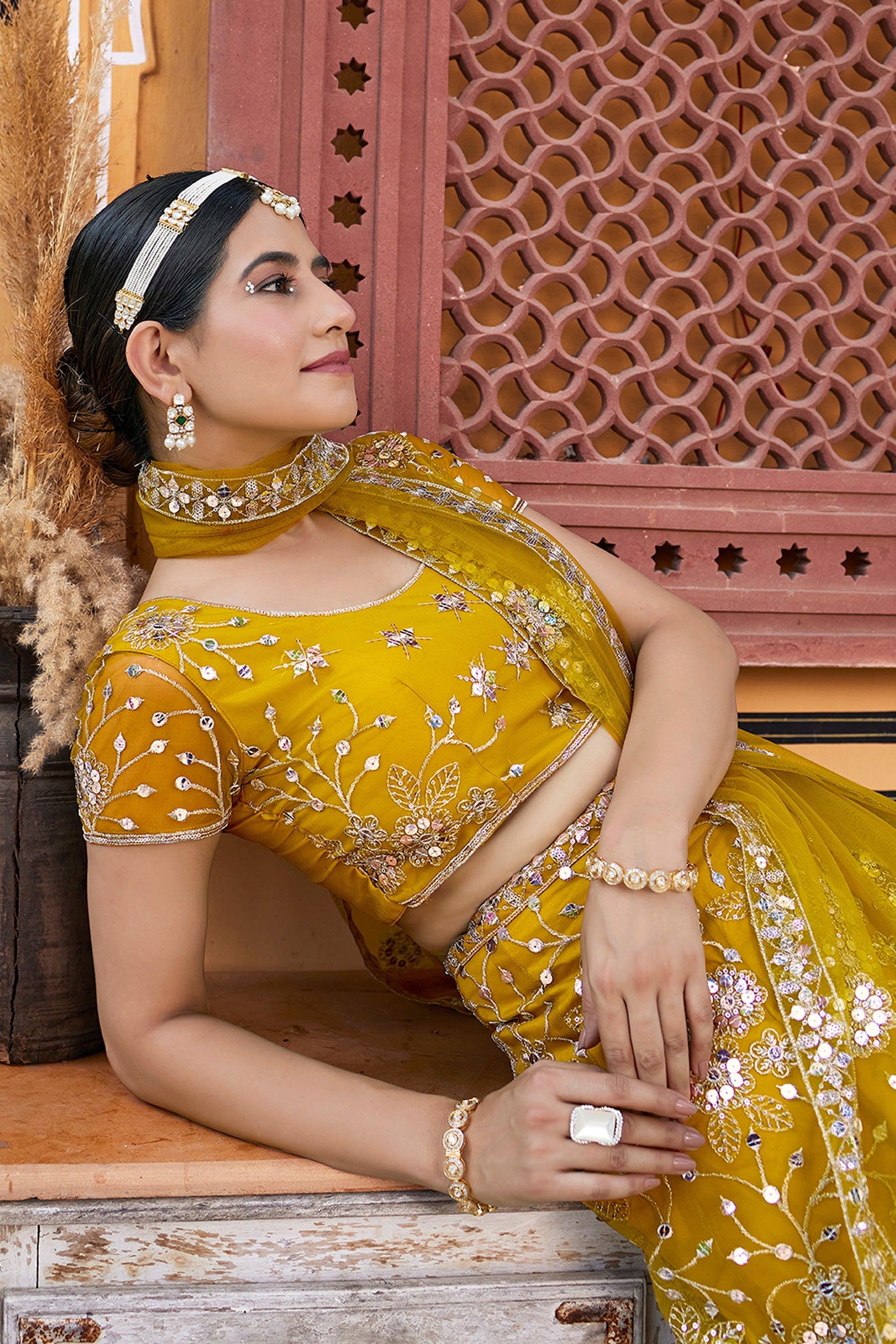 Mustard Color Alluring Sequins Work Lehenga Choli In Net Fabric