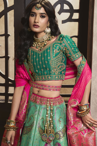 Engaging Sea Green Color Silk Fabric Bridal Lehenga With Sequins Work