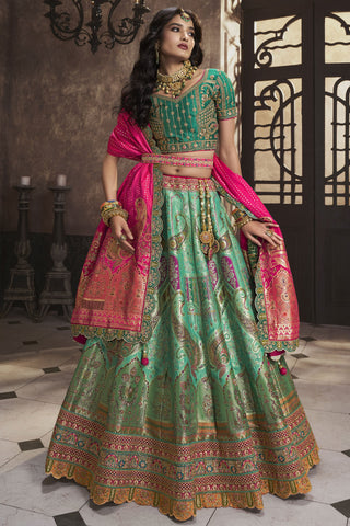 Engaging Sea Green Color Silk Fabric Bridal Lehenga With Sequins Work