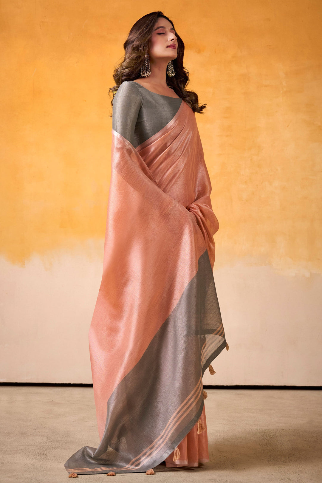 Beguiling Festive Wear Peach Color Tissue Silk Fabric Saree