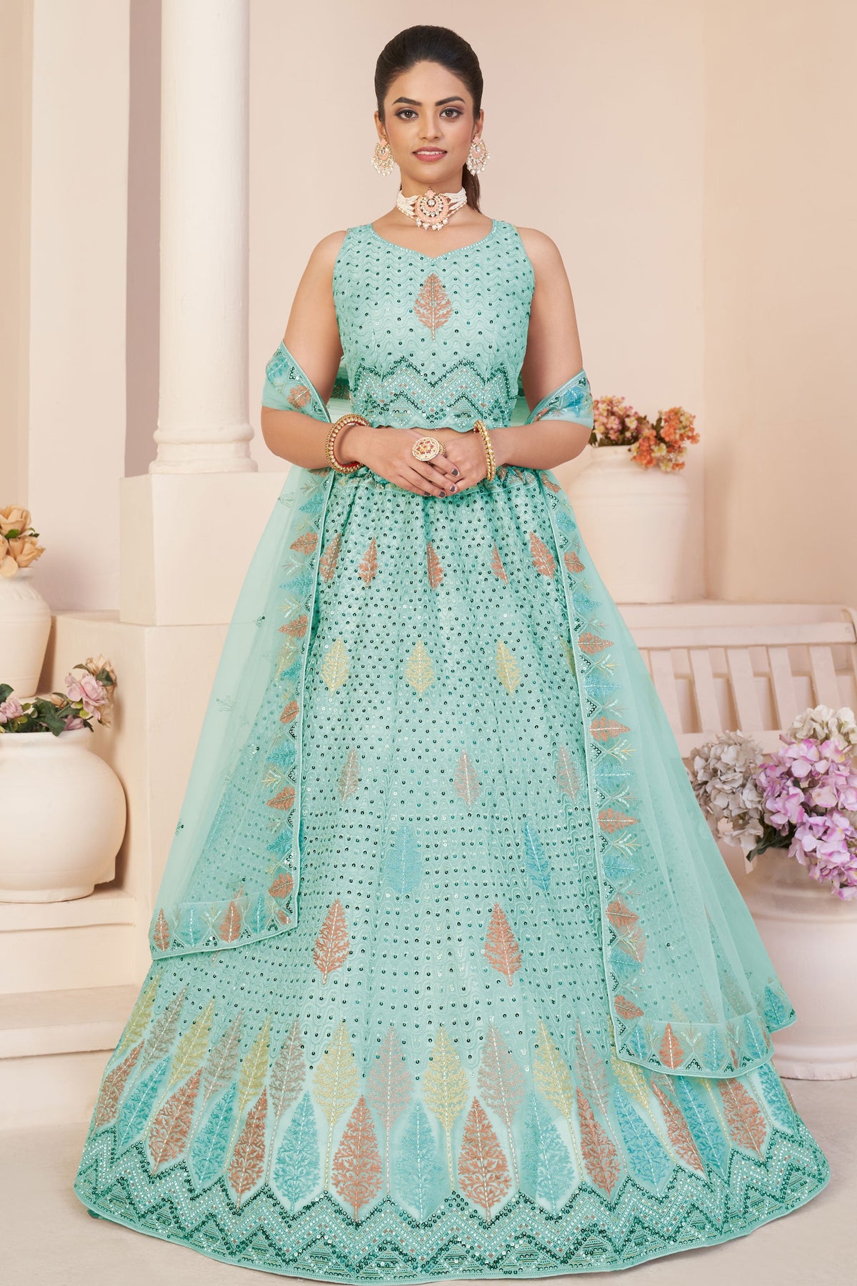 Sea Green Color Net Fabric Enticing Sequins Work Lehenga