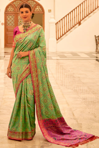 Sea Green Color Glorious Banarsi Silk Patola Saree With Printed Work