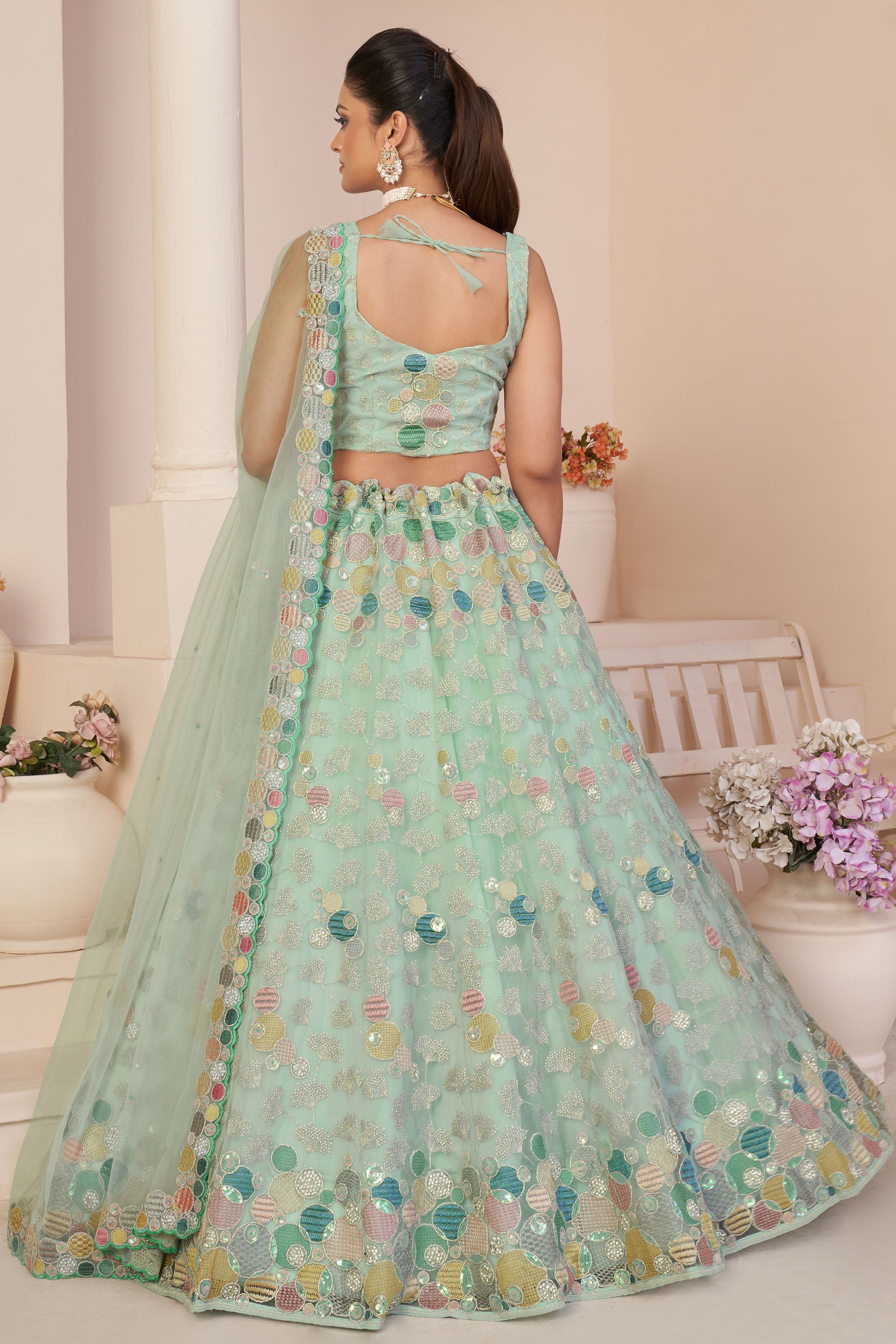 Glamorous Sea Green Color Embroidered Designs Net Fabric Lehenga