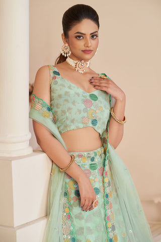 Glamorous Sea Green Color Embroidered Designs Net Fabric Lehenga