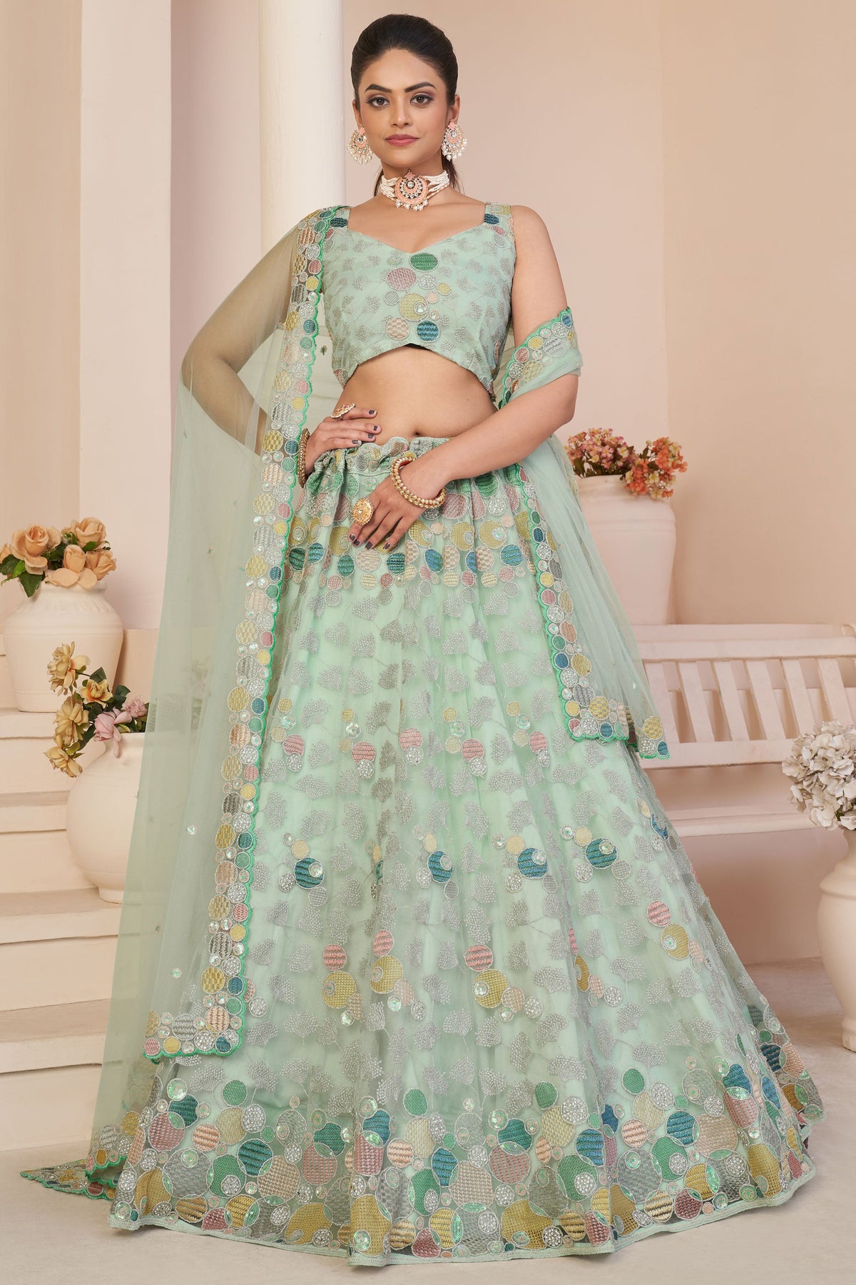 Glamorous Sea Green Color Embroidered Designs Net Fabric Lehenga