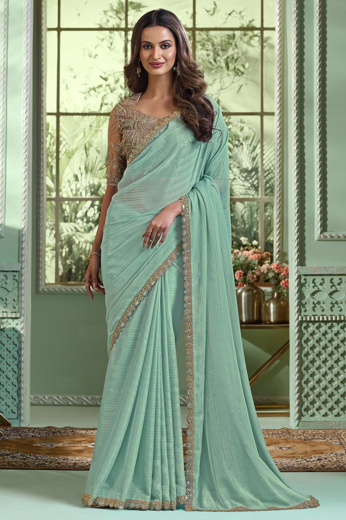 Radiant Border Work On Sea Green Color Chinon Fabric Saree