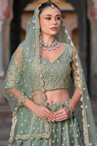 Embroidered Net Fabric Ravishing Lehenga In Sea Green Color