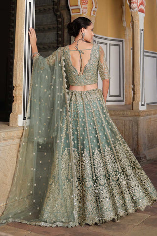 Embroidered Net Fabric Ravishing Lehenga In Sea Green Color