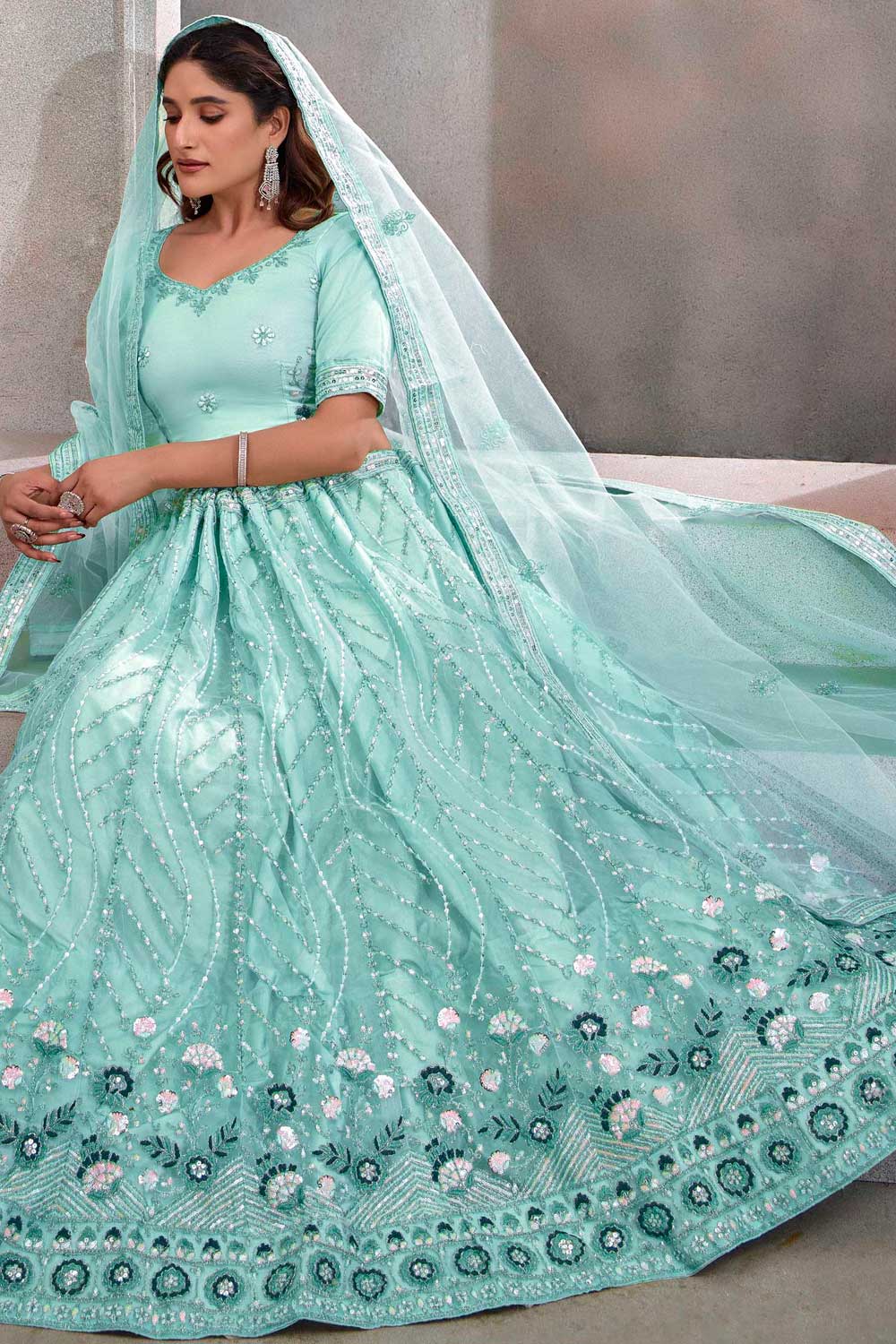 Glamorous Cyan Color Function Wear Net Fabric Lehenga