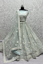 Load image into Gallery viewer, Net Fabric Sangeet Wear Wear Luminous Lehenga In Sky Blue Color
