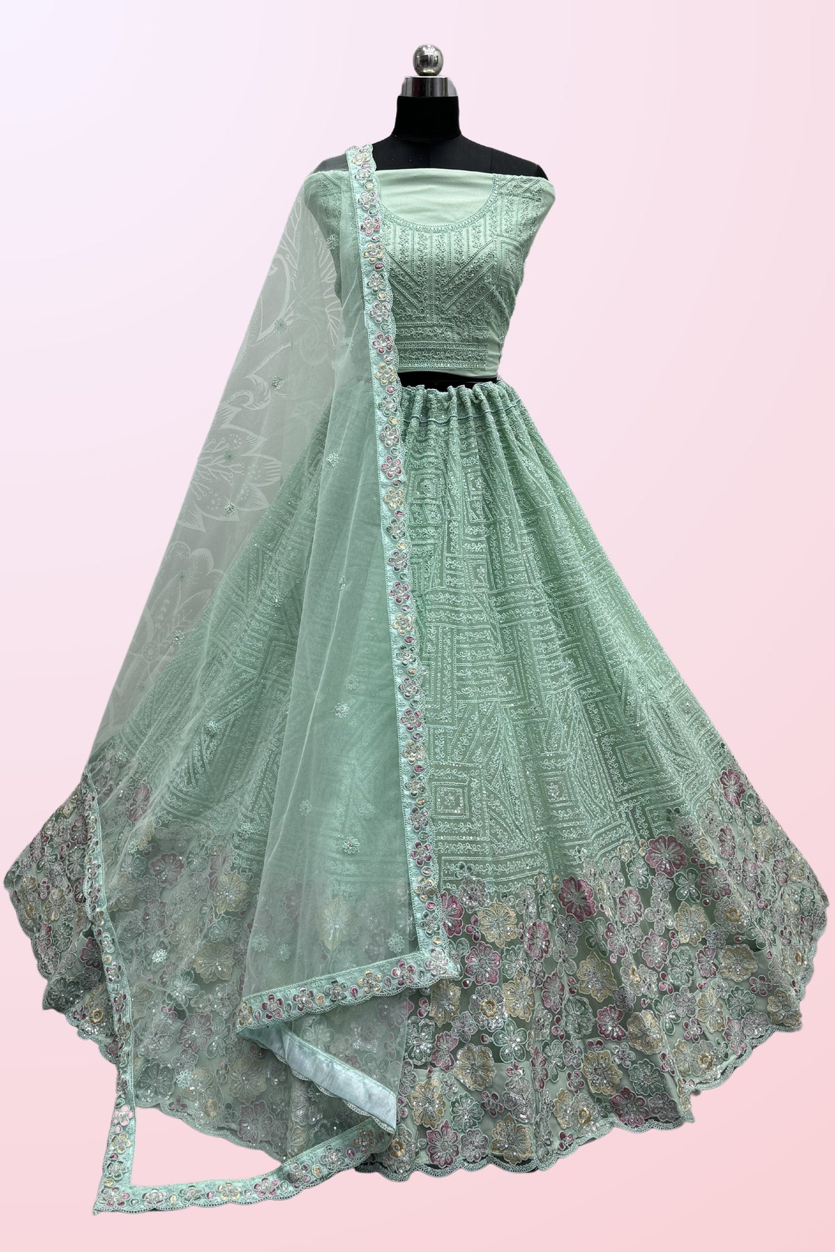 Sea Green Color Fascinating  Sequins Embroidered Net Fabric Lehenga