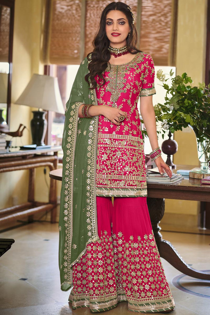 Pretty Georgette Fabric Embroidered Rani Color Festive Wear Palazzo Suit