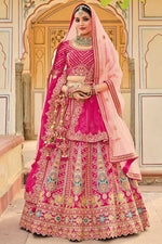 Load image into Gallery viewer, Silk Fabric Rani Color Embroidered Work Soothing Bridal Lehenga With Double Dupatta
