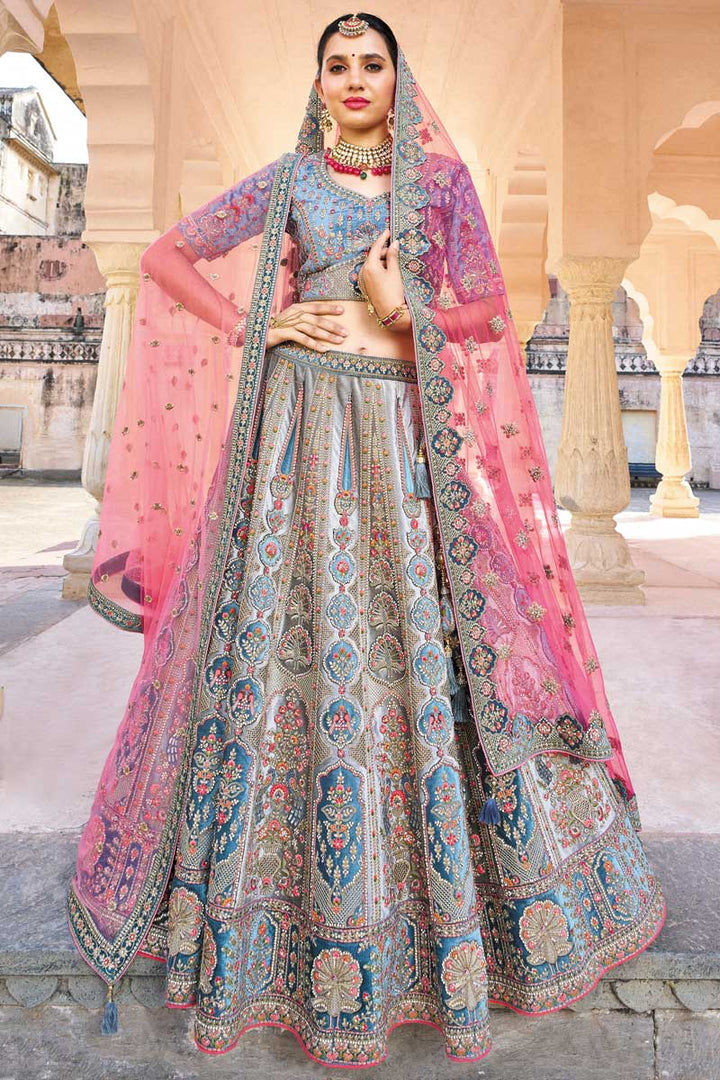 Silk Fabric Embroidered Work Bewitching Cyan Color Bridal Lehenga