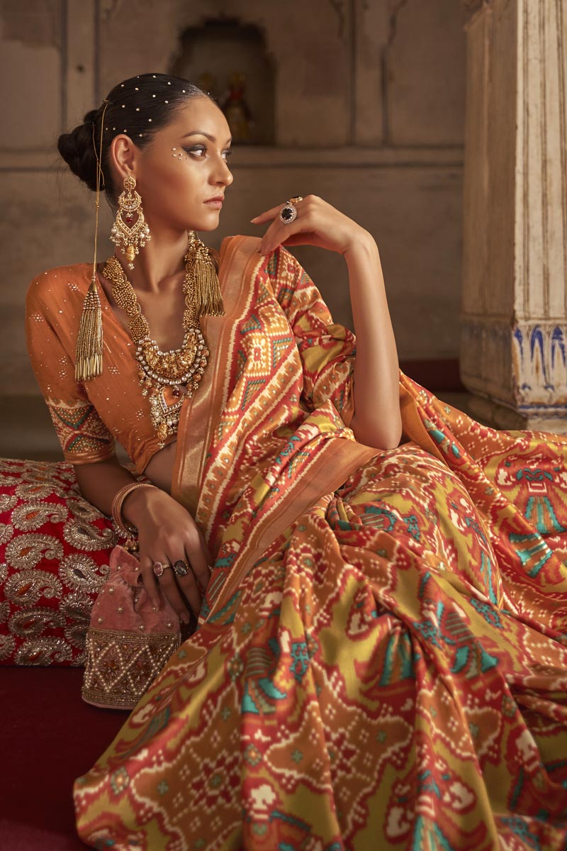 Art Silk Fabric Orange Color Patola Printed Magnificent Saree