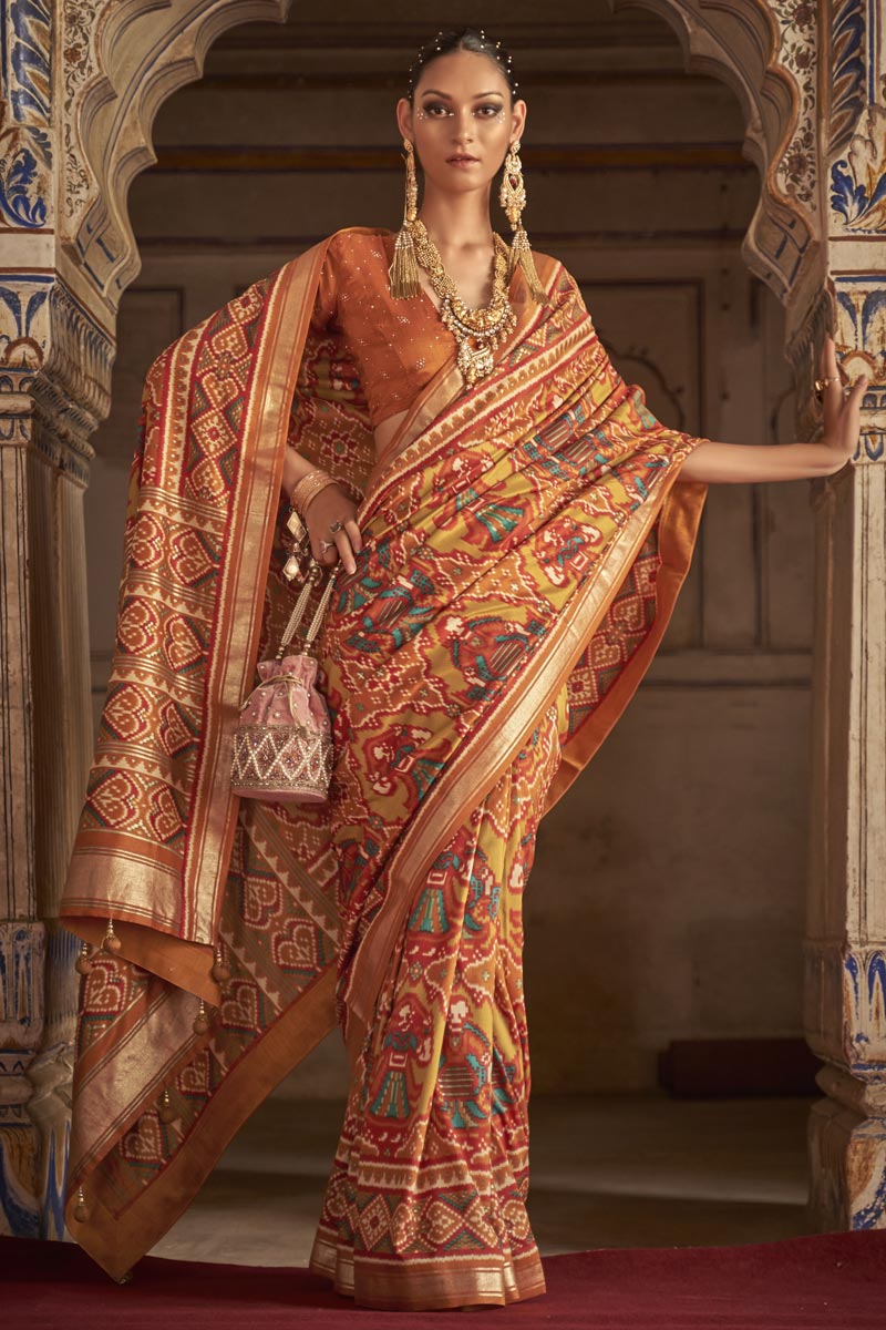 Art Silk Fabric Orange Color Patola Printed Magnificent Saree