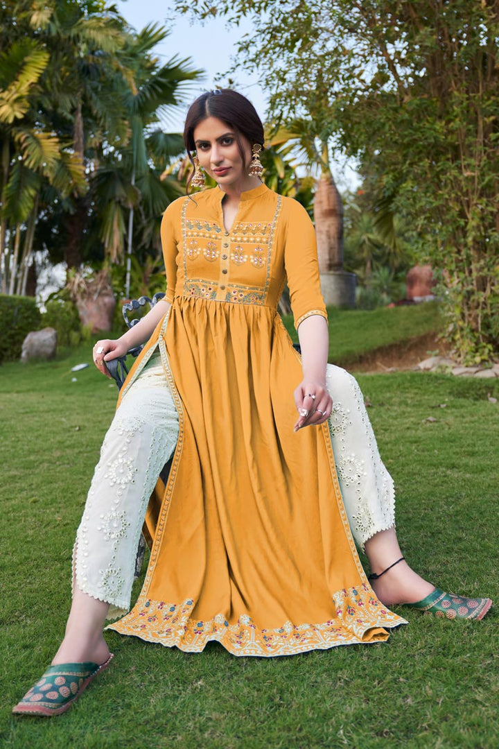 Fancy Mustard Color Party Wear Embroidered Kurti With Pant In Rayon Fabric