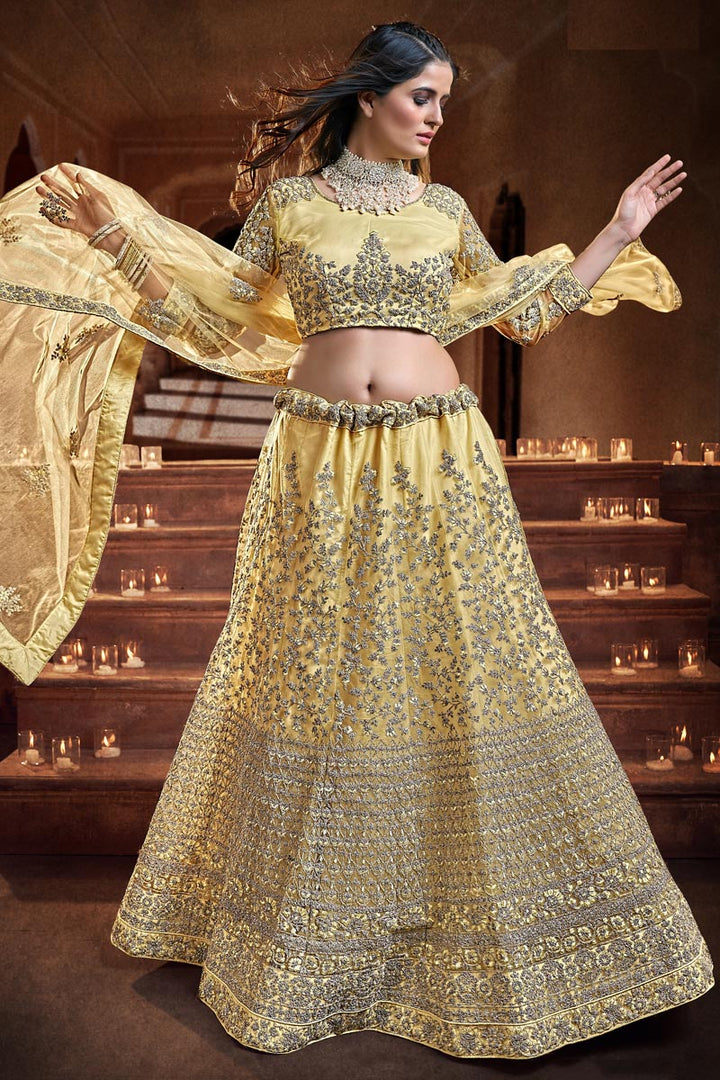 Georgette And Net Fabric Yellow Color Majestic Sequins Work Wedding Wear Lehenga Choli