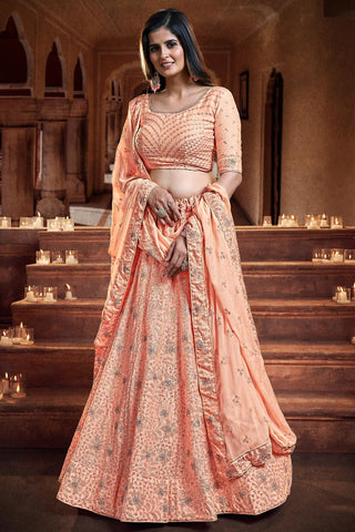 Georgette And Net Fascinate Sequins Work Reception Wear Lehenga Choli In Peach Color