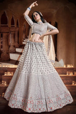 Load image into Gallery viewer, Glamorous Georgette And Net Sequins Work Lehenga Choli In Cream Color
