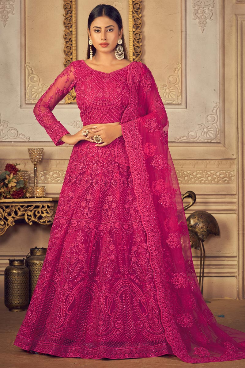 Beautiful Net Fabric Sangeet Wear EmbroideRani Lehenga Choli In Rani Color