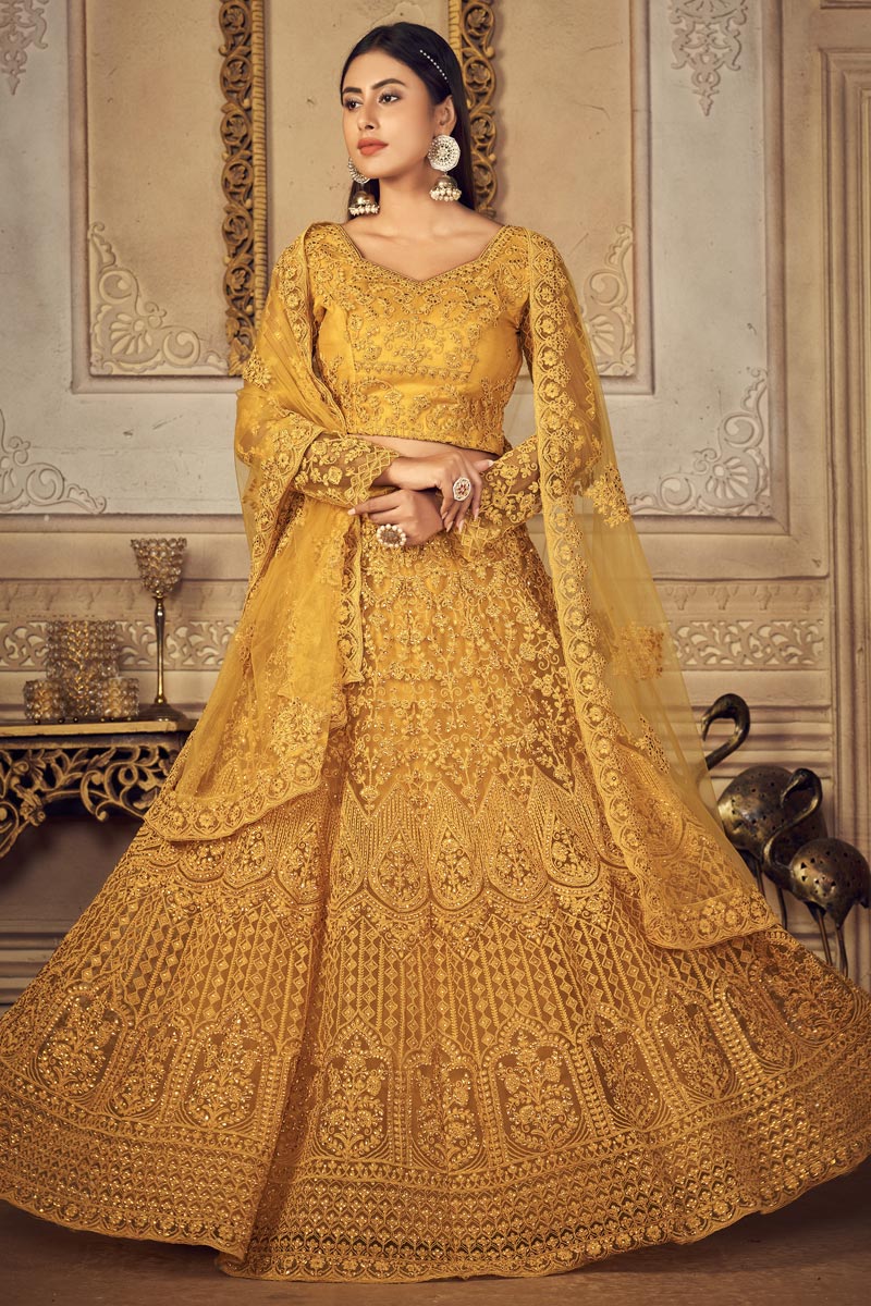 Mustard Color Pretty Net Fabric Wedding Wear EmbroideMustard Lehenga Choli