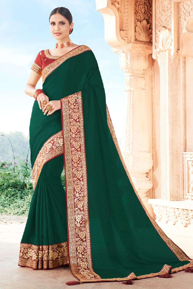Party Wear Art Silk Fabric Fancy Border Work Saree In Dark Green Color