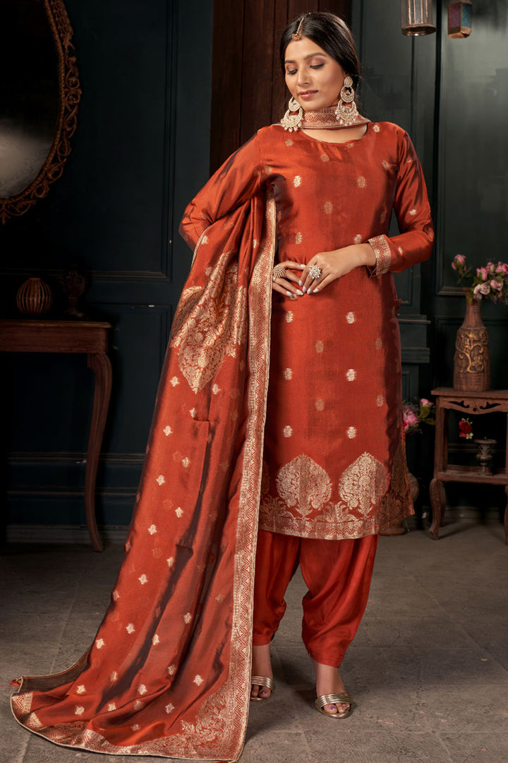 Beguiling Rust Color Art Silk Fabric Weaving Designs Patiala Suit
