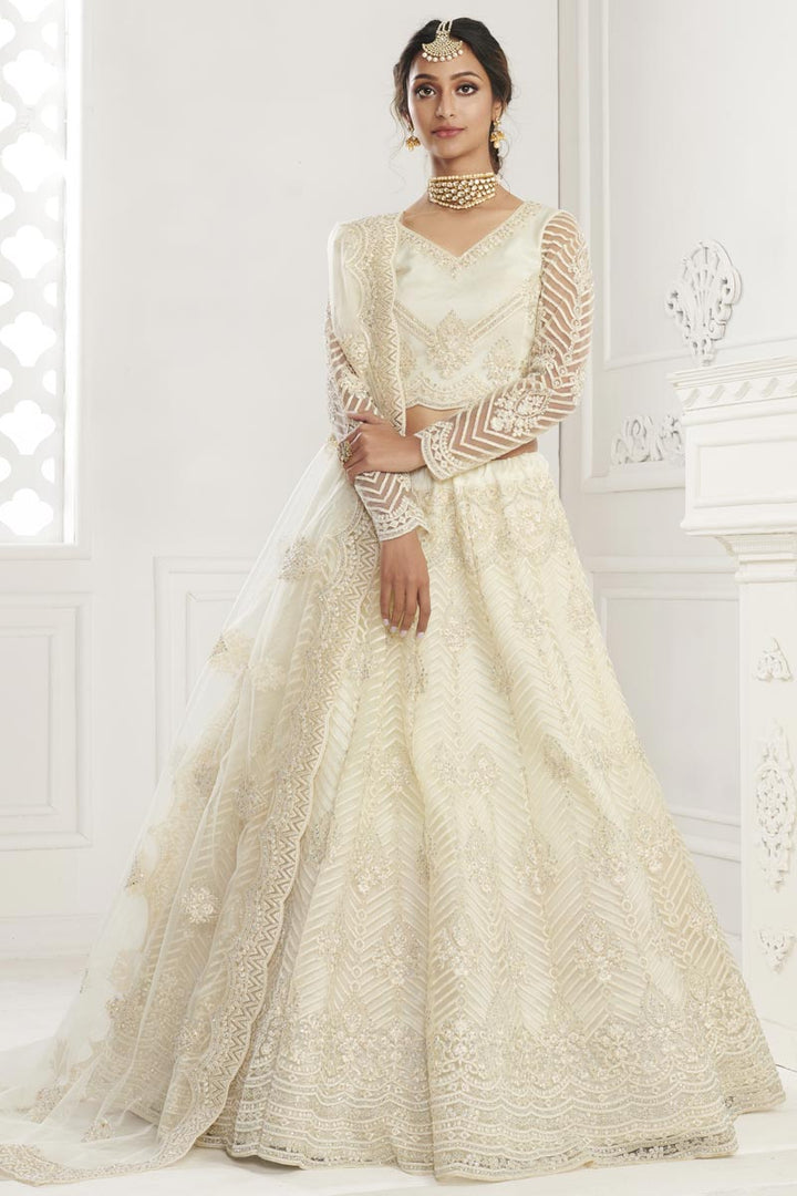 Net Fabric Fancy Wedding Wear Lehenga Choli In Beige Color