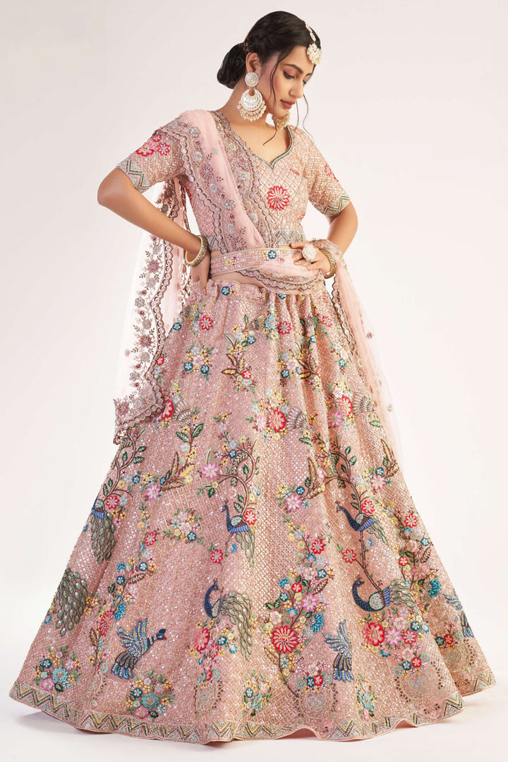 Pretty Net Fabric Embroidered Wedding Wear Lehenga Choli In Pink Color