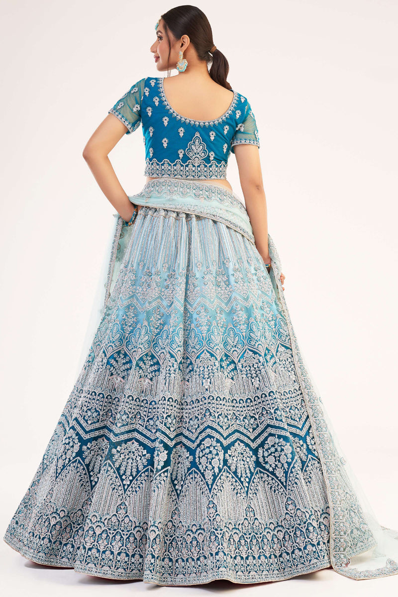 Net Fabric Cyan Color Glamorous Embroidered Wedding Wear Lehenga Choli