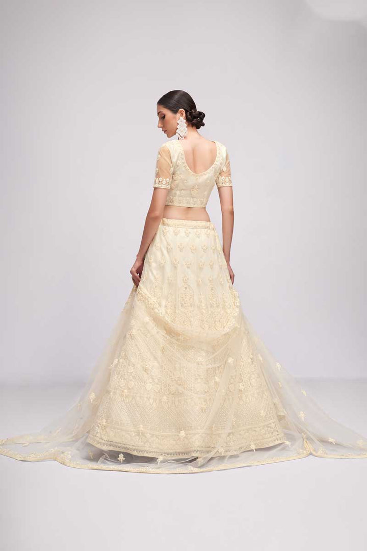 Beguiling Embroidered Work On Off White Color Net Fabric Lehenga