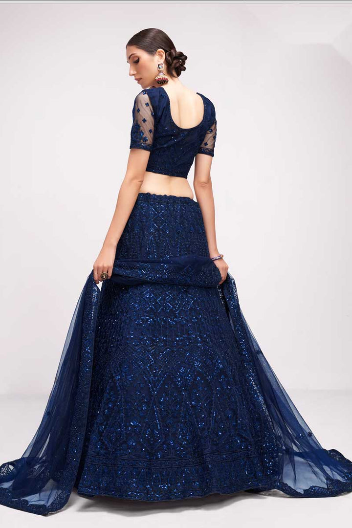 Tempting Net Fabric Blue Color Lehenga With Embroidered Work