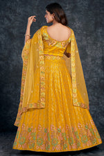 Load image into Gallery viewer, Silk Fabric Sangeet Wear Brilliant Lehenga In Yellow Color
