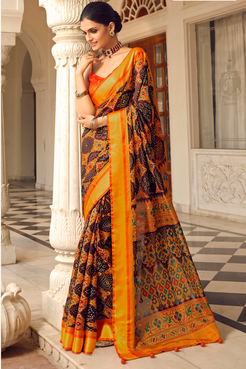 Fancy Brasso Fabric Puja Wear Orange Color Printed Saree