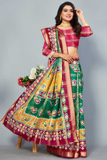 Load image into Gallery viewer, Green Color Engrossing Patola Printed Saree In Cotton Fabric

