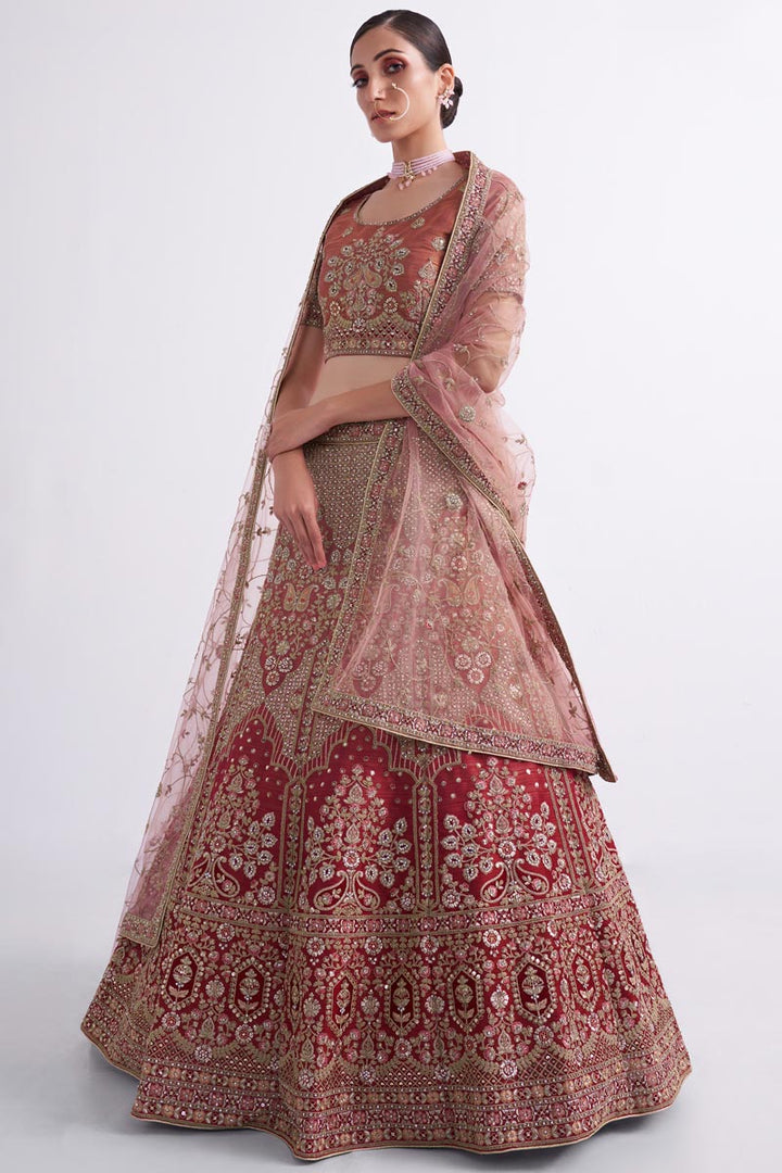 Charming Wedding Style Rust Color Bridal Lehenga In Net Fabric