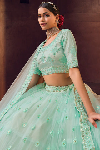 Sea Green Color Embroidered Net Fabric Tempting Lehenga