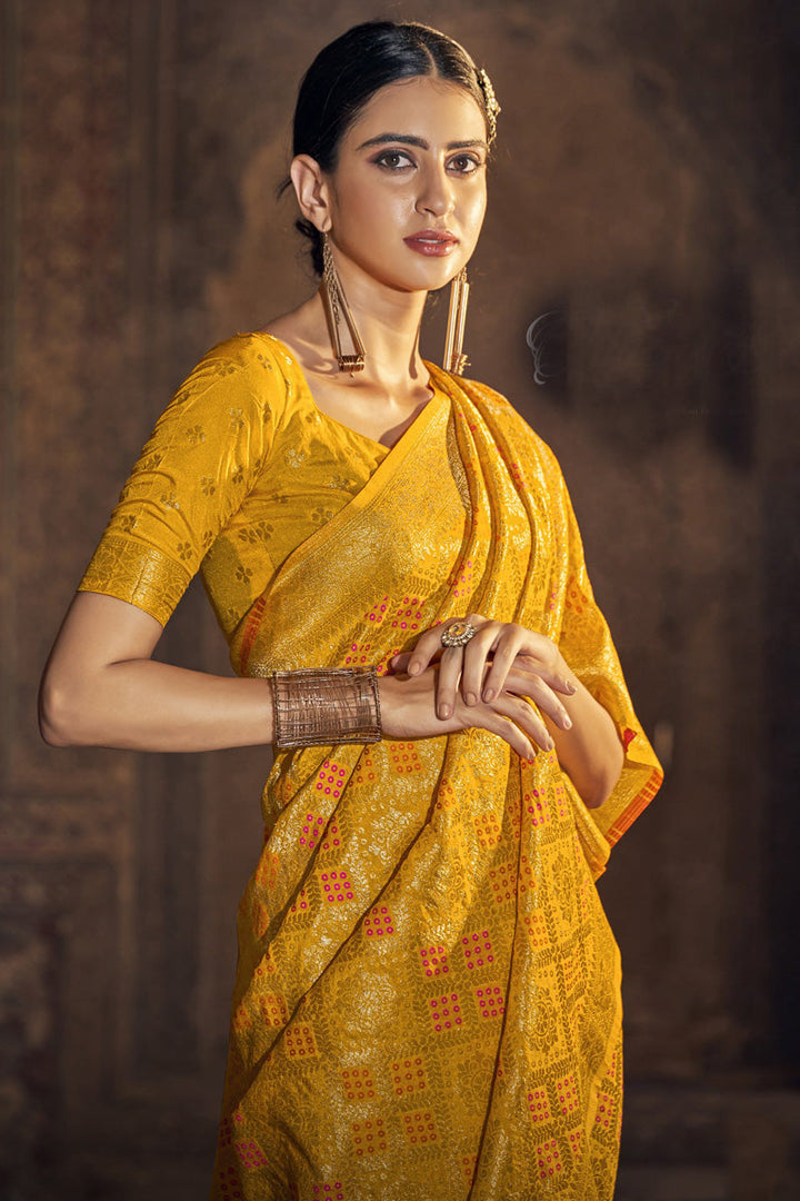 Engaging Mustard Color Chinon Fabric Bandhani Printed Saree