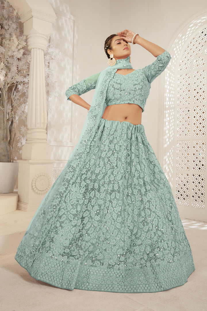 Classic Embroidered Work On Sea Green Color Function Wear Lehenga In Net Fabric