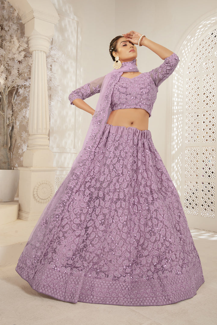 Creative Embroidered Work On Designer Lehenga In Lavender Color Net Fabric