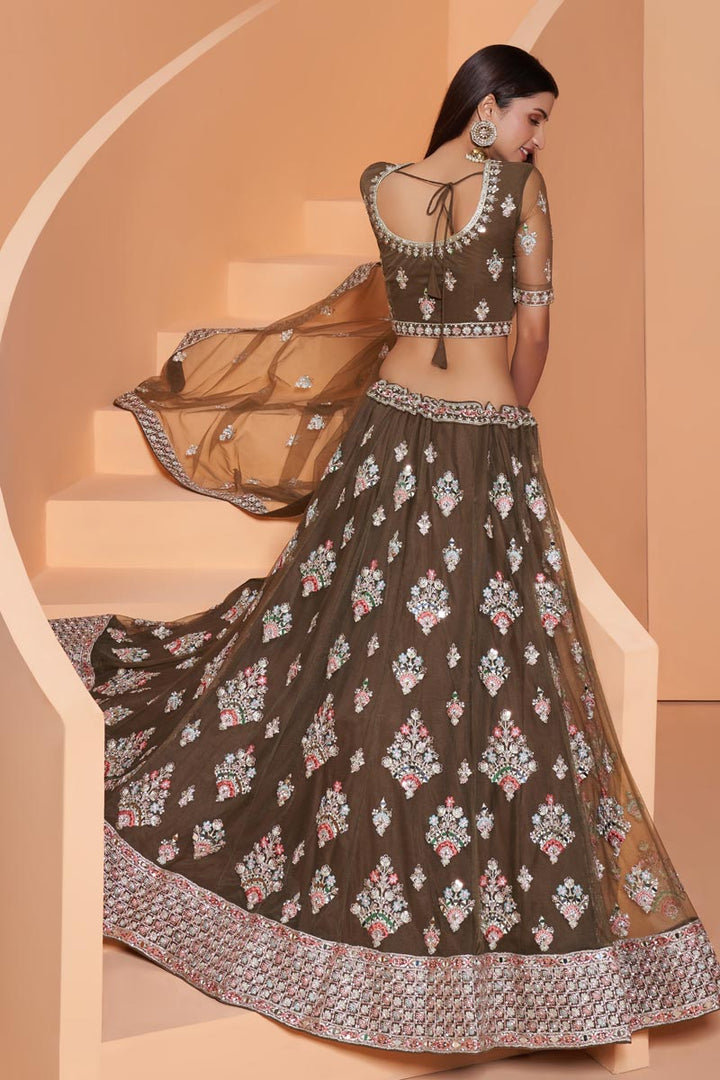 Wedding Function Wear Net Fabric Embroidered Lehenga Choli In Dark Beige Color