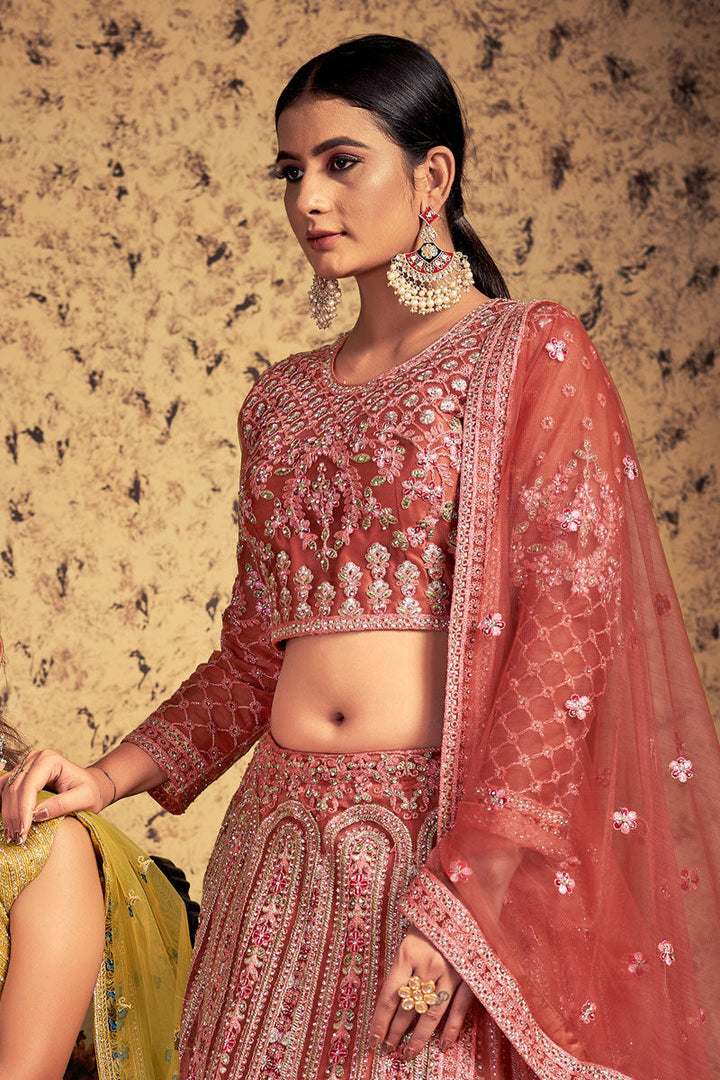 Sangeet Wear Peach Color Tempting Net Readymade Lehenga Choli