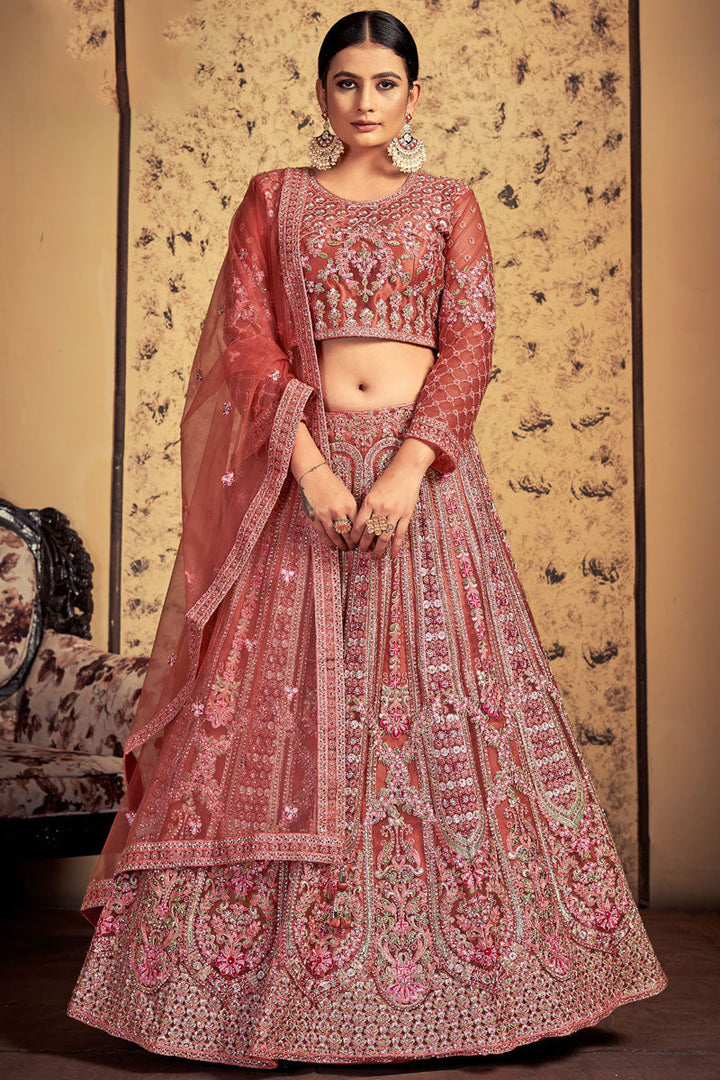 Sangeet Wear Peach Color Tempting Net Readymade Lehenga Choli