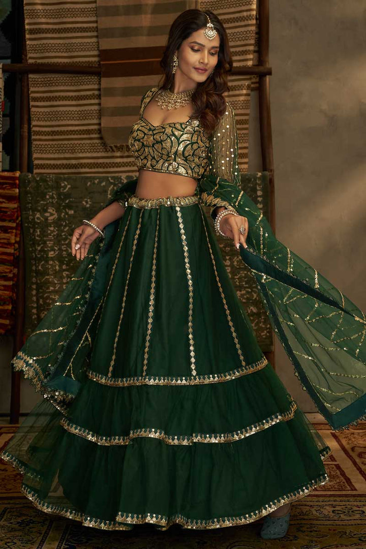 Tempting Net Fabric Off Green Color Lehenga With Sequins Work
