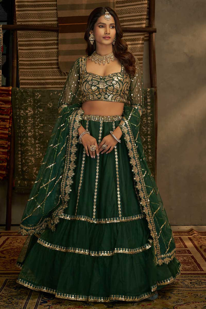 Tempting Net Fabric Off Green Color Lehenga With Sequins Work