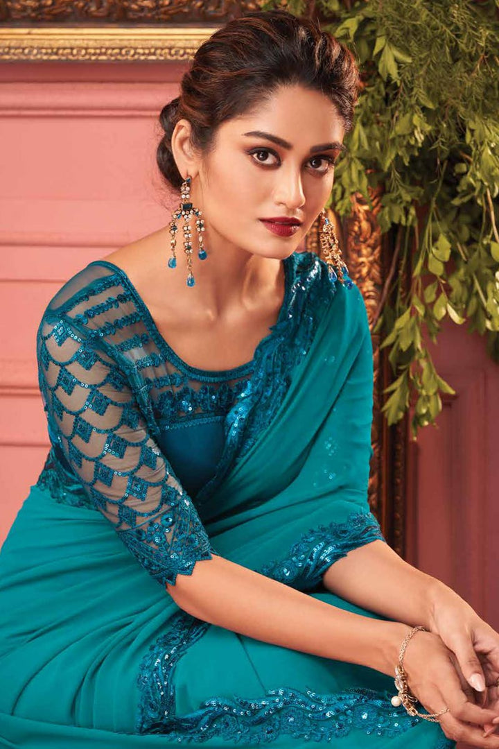 Teal Color Enticing Function Wear Border Work Georgette Fabric Saree